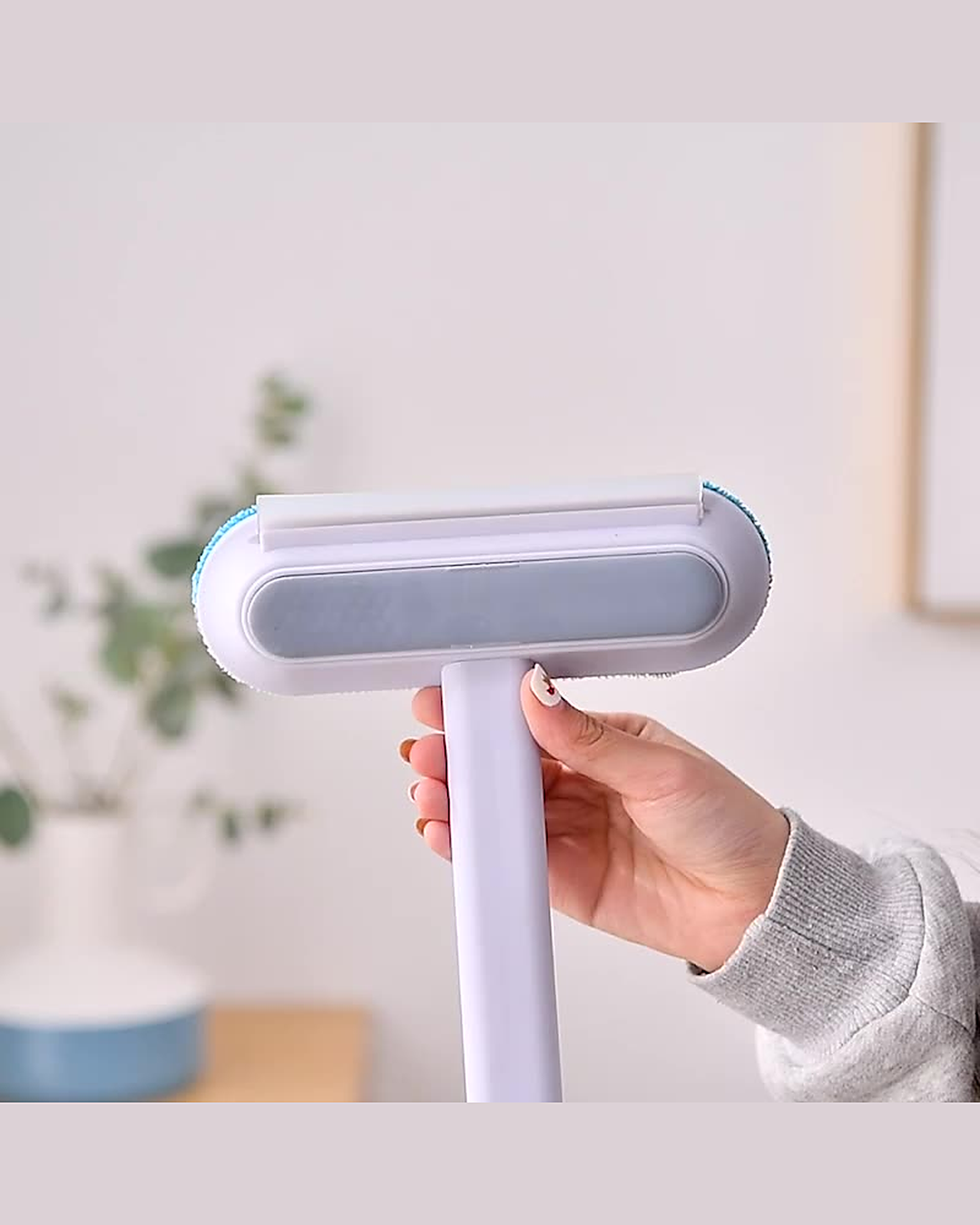 4-in-1 brush held in one hand