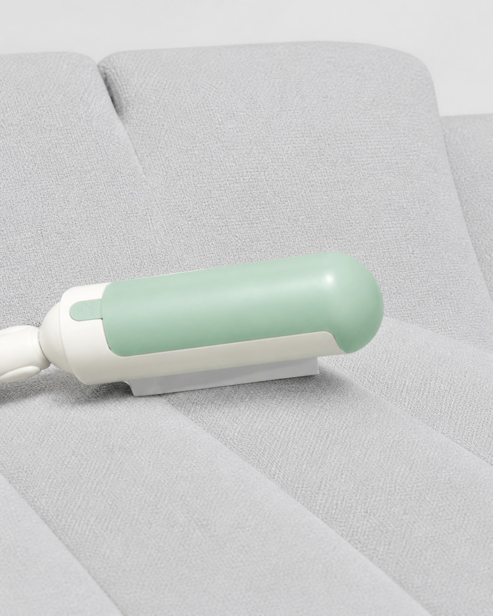 Pet hair remover drawn across a sofa cushion