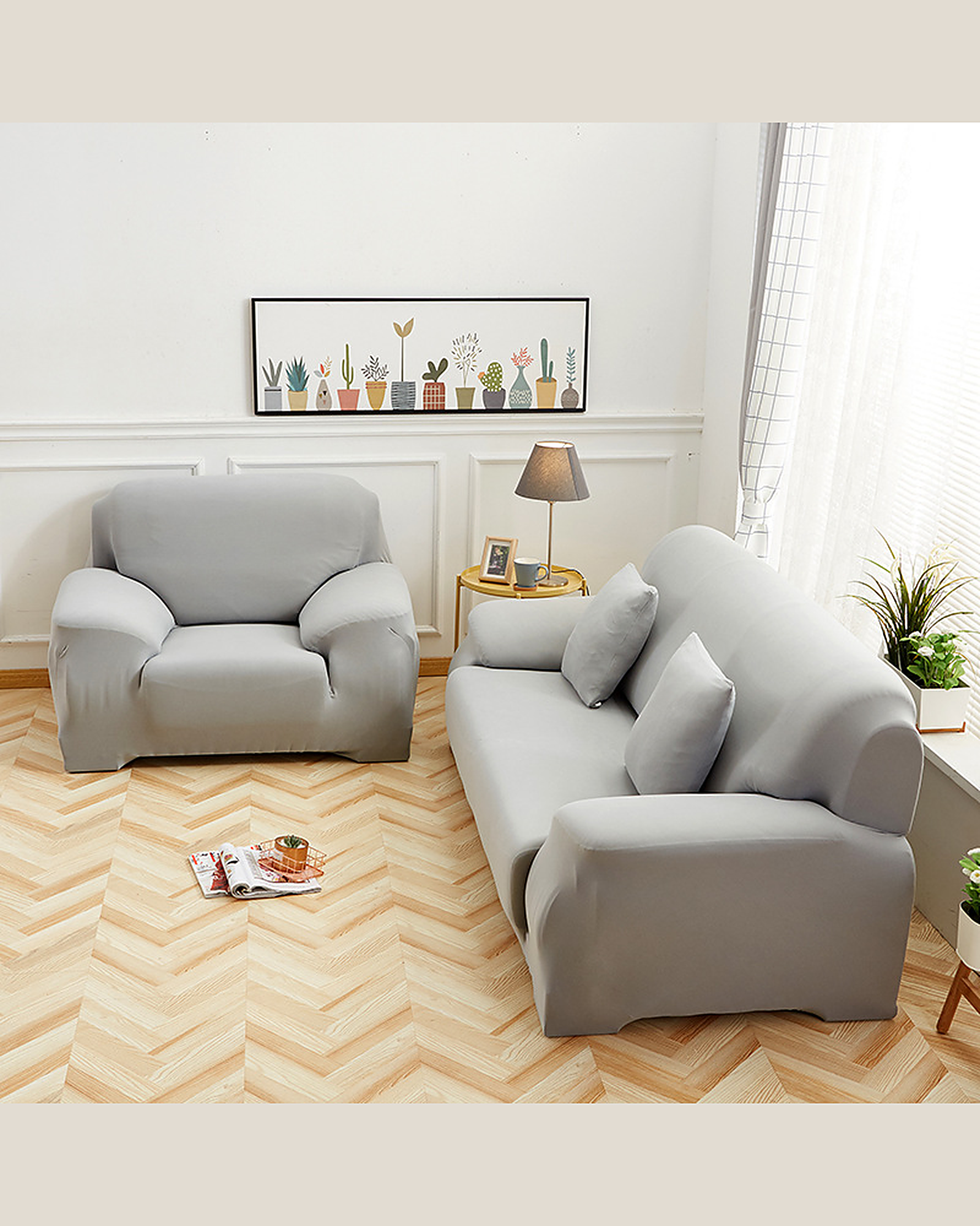 Light grey slipcover on a two-seater and armchair